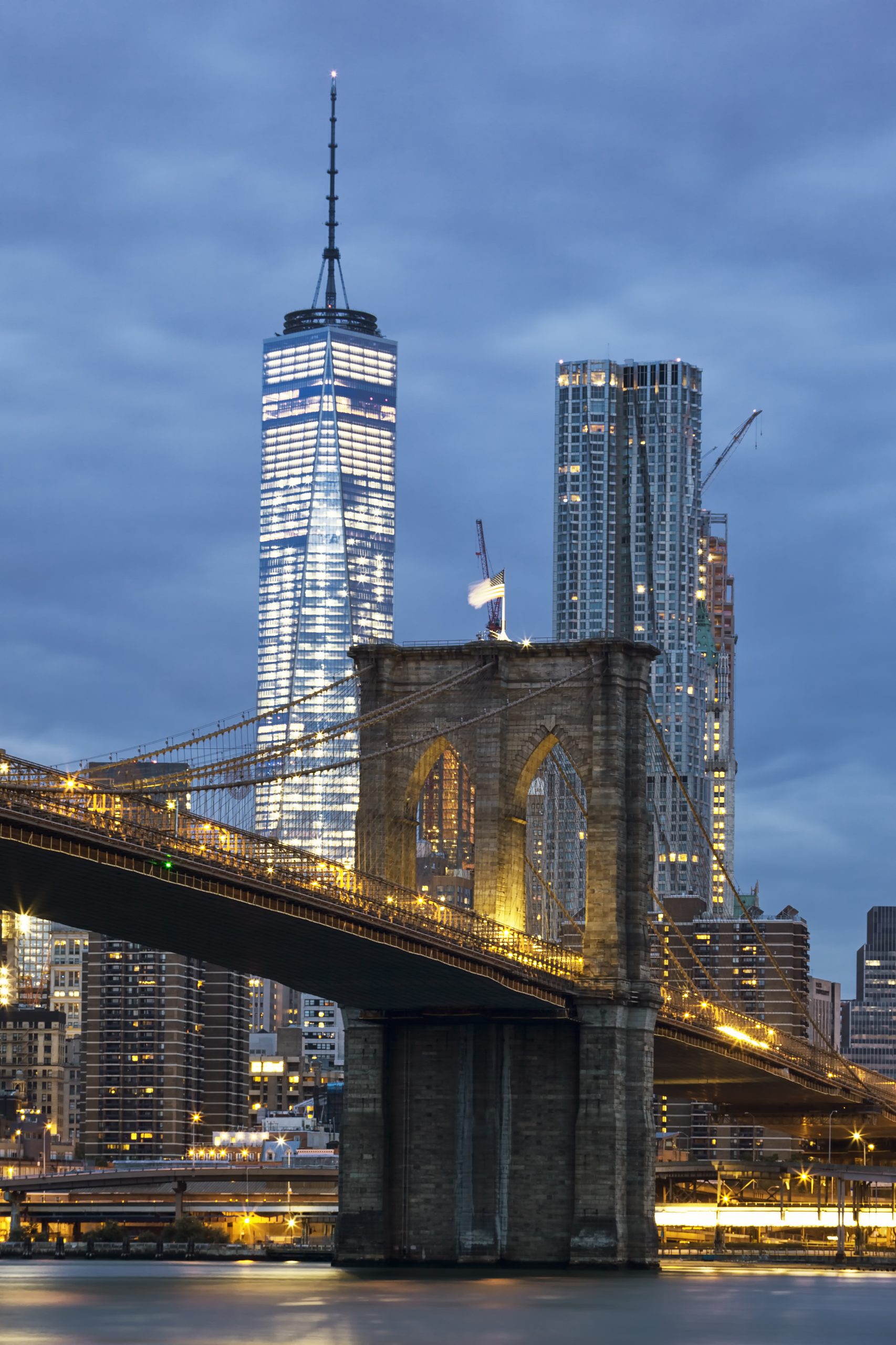 Brooklyn Bridge at dusk viewed from the Brooklyn Bridge Park in New York City.